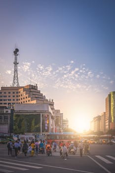 Xian, China -  August 2019 : Crowd of people crossing the busy street in the city of Xian in summer, Shaanxi Province