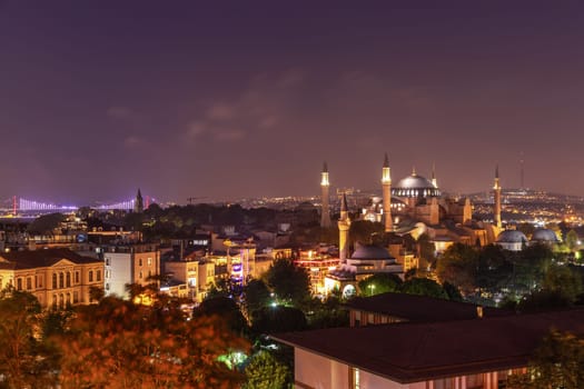 Night Istanbul, view on Hagia Sophia, the Bosphorus Bridge and the Galata Tower.
