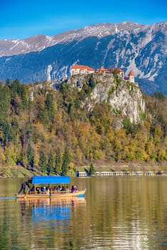 BLED ,SLOVENIA - NOVEMBER 11, 2017 -Traditional Pletna boat on the lake. Bled lake Slovenia
