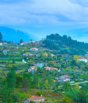 View of Douro river valley villages in rainy weather. Portugal