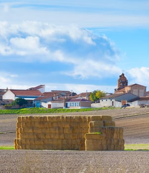 Landscape with village and stack of hay. Spain