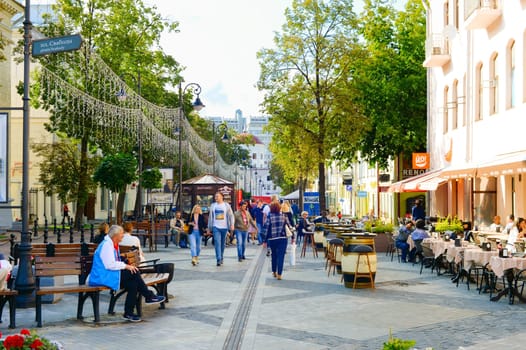 MINSK, BELARUS - JULY 17, 2019: People walking by Downtown street of Minsk. Minsk is the capital of Belarus