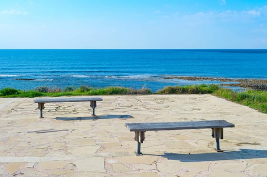 Empty benches by the sea. Paphos, Cyprus