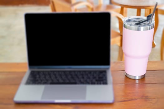 Online wireless device on wooden table, stock phto