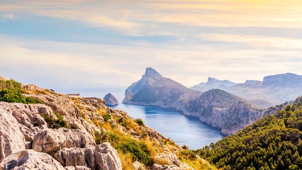 View from the Mirador Es Colomer towards the island Colomer and the mountain range on Formentor peninsula, beautiful sunset, Mallorca, Spain