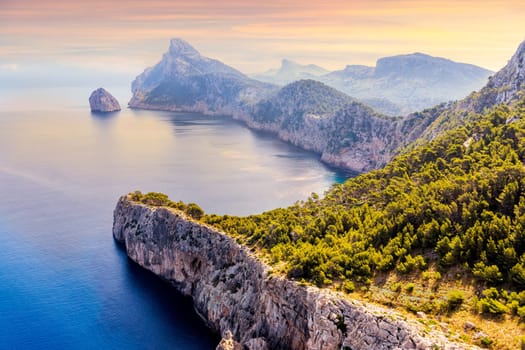 View from the Mirador Es Colomer towards the island Colomer and the mountain range on Formentor peninsula, beautiful sunset, Mallorca, Spain