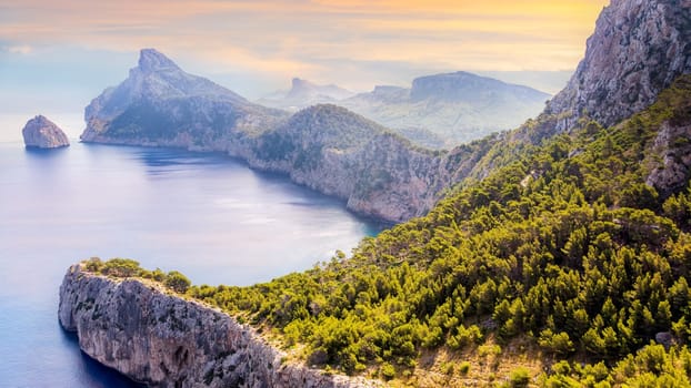 View from the Mirador Es Colomer towards the island Colomer and the mountain range on Formentor peninsula, beautiful sunset, Mallorca, Spain