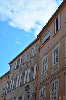 House facade in the old town of Saint Tropez, France, with blue sky