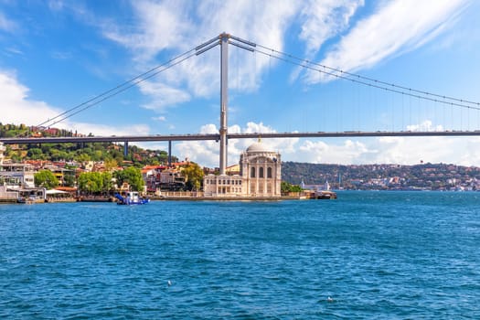 Ortakoy Mosque and the Bosphorus Bridge, view from the ferry, Istanbul, Turkey.