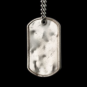 Old and worn blank military dog tags isolated on black
