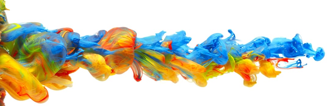 Rainbow of colorful paints and inks swirling together in flowing water abstract background
