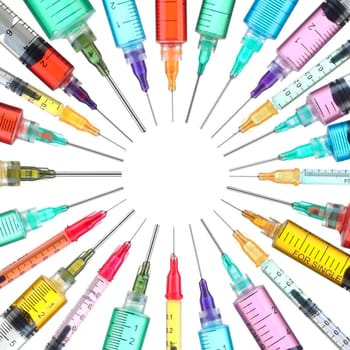 Circle of bright colorful syringes