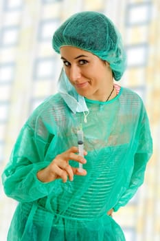 young woman nurse portrait with a syringe