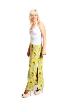 A smiling blond woman wearing a colorful dress