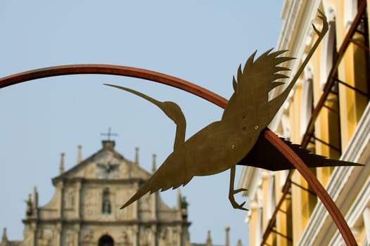Statue of egret and Ruins of St Paul's Cathedral, Macau