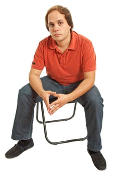 young casual man on a chair, isolated on white
