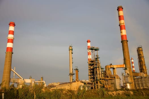 portuguese industrial power plant at sunset light
