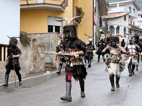 Orani, Sardinia, Italy - February 15, 2015: Parade of traditional masks of Sardinia during the Carnival 2015 in Orani.
