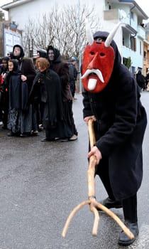 Orani, Sardinia, Italy - February 15, 2015: Parade of traditional masks of Sardinia during the Carnival 2015 in Orani.