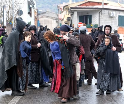Orani, Sardinia, Italy - February 15, 2015: Parade of traditional masks of Sardinia during the Carnival 2015 in Orani.