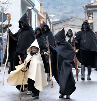 Orani, Sardinia, Italy - February 15, 2015: Parade of traditional masks of Sardinia during the Carnival 2015 in Orani.
