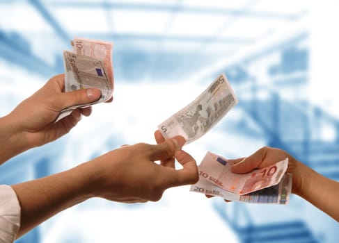 person handing money to another person detail