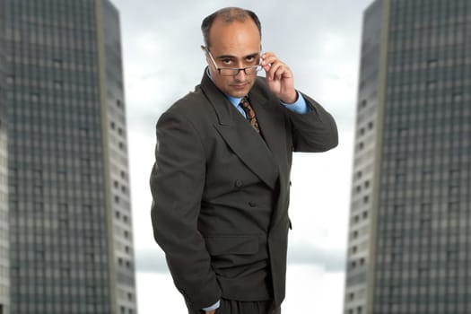 mature business man thinking taking off his glasses