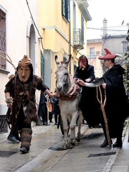 Orani, Sardinia, Italy - February 15, 2015: Parade of traditional masks of Sardinia during the Carnival 2015 in Orani.
