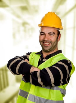young happy worker portrait with arms crossed