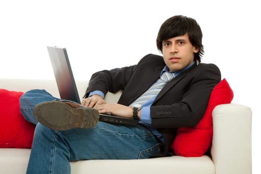 young man working with laptop in a couch