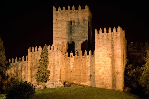 Guimaraes Castle at night, home of the first Portuguese King, Afonso Henriques, this is the place where Portugal was born. Guimaraes is in the north of the country.