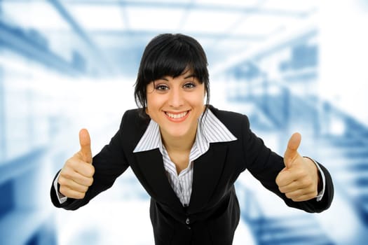young business woman portrait going thumbs up, isolated on white background