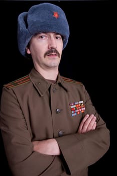 young man dressed as russian military, studio