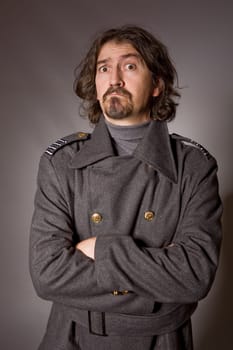 young man dressed as russian military, studio picture