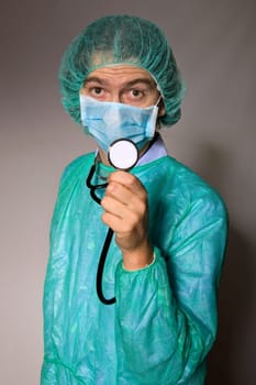 young mal doctor, on a dark background
