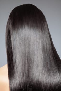 Back view of a woman with long straight hair