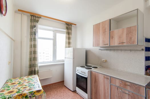 Russia, Moscow- May 07, 2018: interior room apartment. standard repair decoration in hostel. kitchen and dining room