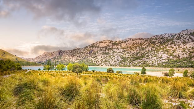 Embassament de Cuber is an artificial turquoise colour lake, water reservoir, located at the valleys of Puig Major and Morro, Sunset, Mallorca, Spain