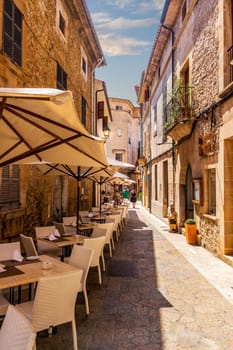 Palma de Mallorca Spain, July 2015 Senior tourists, one on wheelchair, enjoying sightseeing in old narrow alley of Palma de Mallorca, summer afternoon