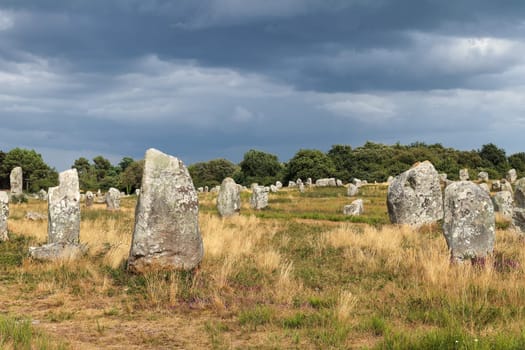 Alignements du Menec - rows of Menhirs - standing stones - the largest megalithic site in the world, Carnac, Brittany, France.