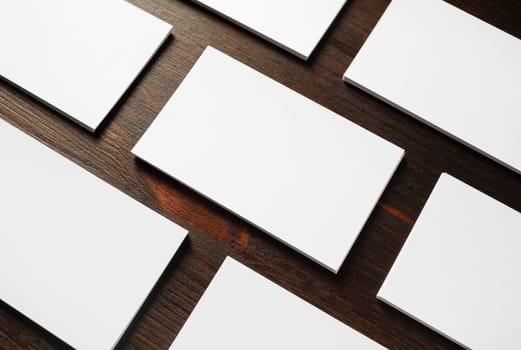 Blank business cards mock-up on wooden background. Copy space for text.