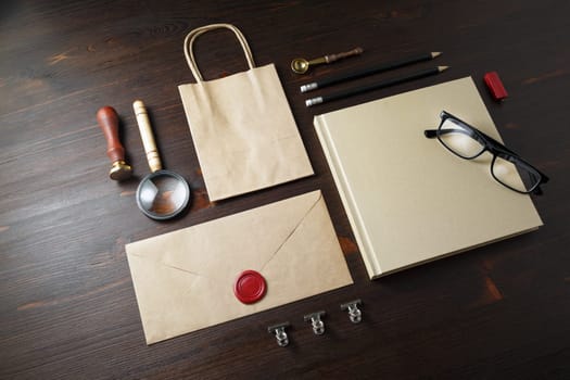 Blank corporate stationery set on wooden background. Branding mock up. Responsive design template.