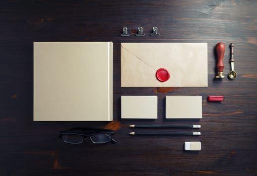Corporate identity template. Blank corporate stationery set on wood table background. Flat lay.