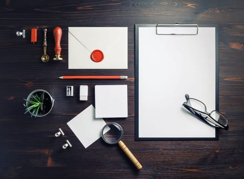 Branding identity mock-up. Blank corporate stationery set on wooden background. Flat lay.