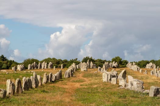 Alignements de Kermario, rows of standing stones - Menhirs, the largest megalithic site in the world, Carnac, Brittany, France.