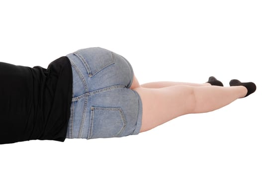 A close up image of the butt of a woman in jeans shorts from the back.lying on the floor in the studio body part, isolated for white background.