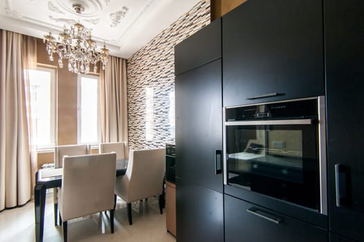 Russia, Moscow- May 12, 2018: interior room apartment. standard repair decoration in hostel. kitchen and dining room