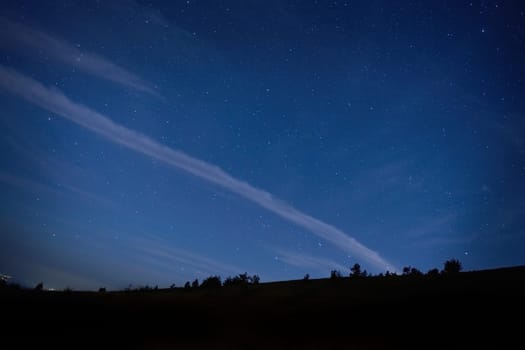 Blue dark night sky with many stars. Space background
