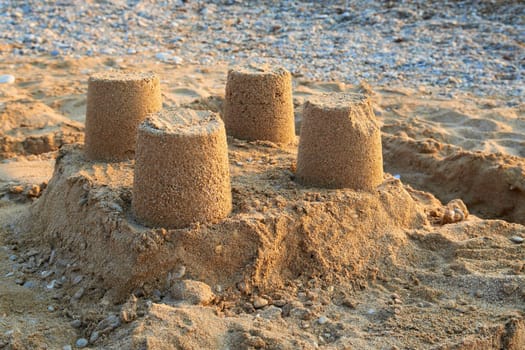 Towers from sand - castle on the beach