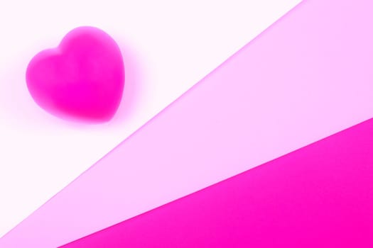 Pink heart on white, pink and purple background, symbol of love for Valentines day, minimalism.